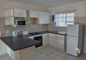 Hartenbos holiday apartment, self-catering Hartenbos, 2 bedroom holiday unit, Hartenbos Central rental, fully furnished apartment, holiday accommodation with Wi-Fi, private braai area.