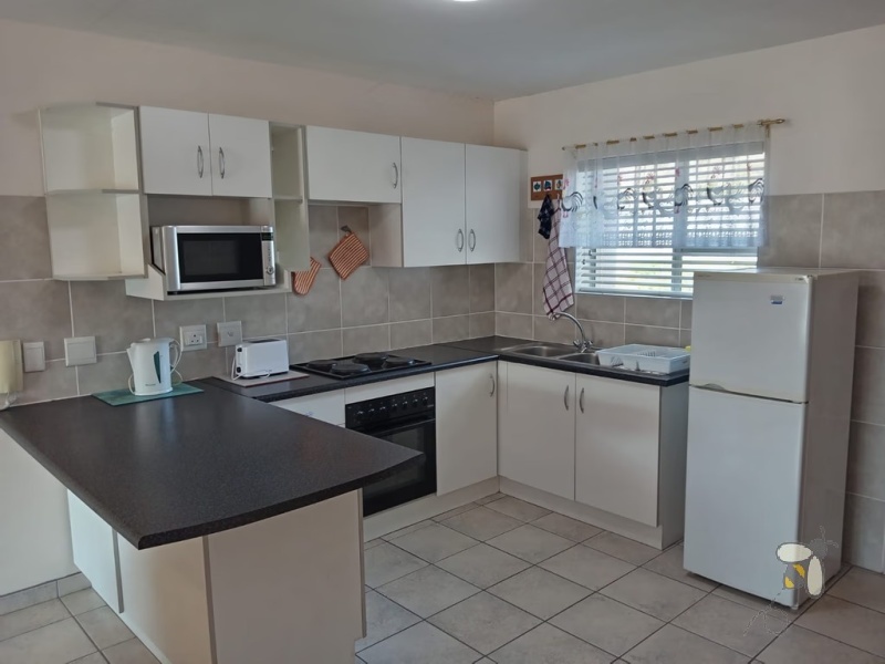 Hartenbos holiday apartment, self-catering Hartenbos, 2 bedroom holiday unit, Hartenbos Central rental, fully furnished apartment, holiday accommodation with Wi-Fi, private braai area.