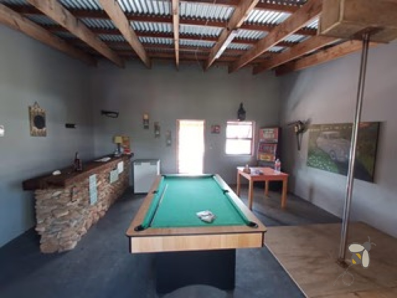 Oudtshoorn guest farm for sale, Swartberg mountains property, Cango Caves tourism investment, farm with accommodation, solar water system farm, tame wildlife property, furnished guest farm.