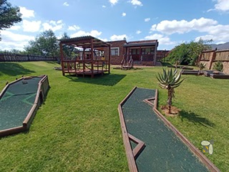 Oudtshoorn guest farm for sale, Swartberg mountains property, Cango Caves tourism investment, farm with accommodation, solar water system farm, tame wildlife property, furnished guest farm.