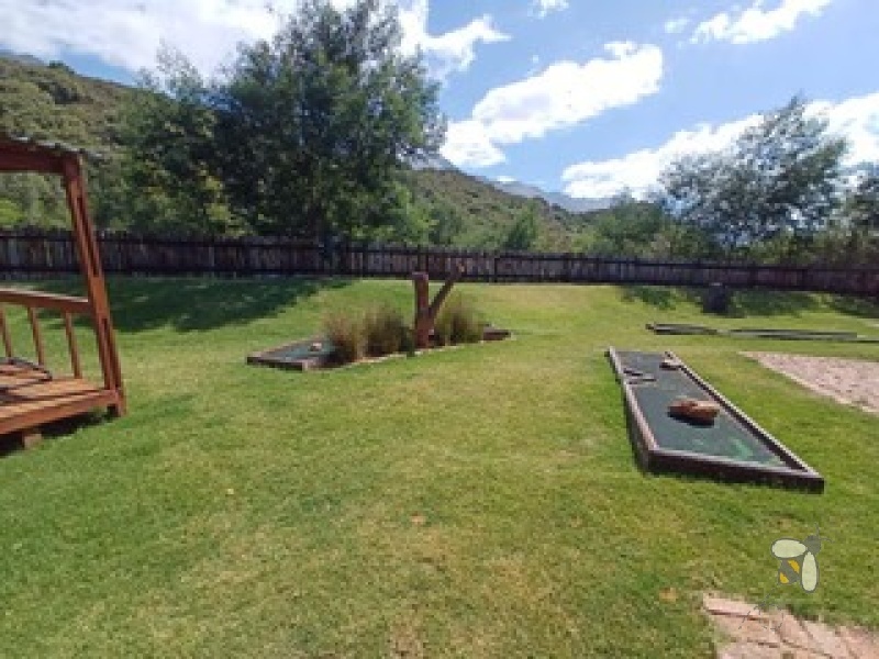 Oudtshoorn guest farm for sale, Swartberg mountains property, Cango Caves tourism investment, farm with accommodation, solar water system farm, tame wildlife property, furnished guest farm.