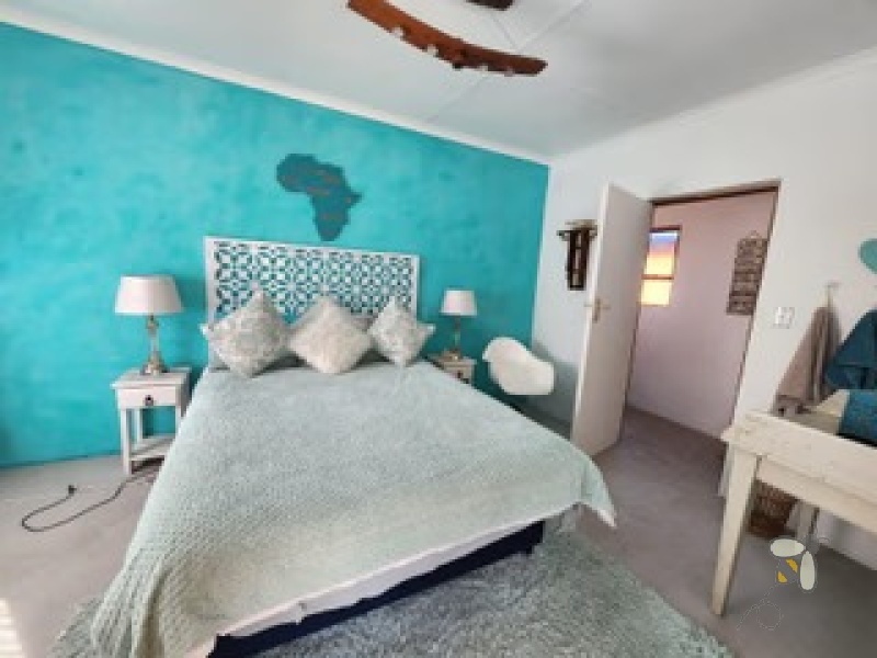 Oudtshoorn guest farm for sale, Swartberg mountains property, Cango Caves tourism investment, farm with accommodation, solar water system farm, tame wildlife property, furnished guest farm.