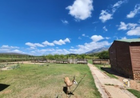 Oudtshoorn guest farm for sale, Swartberg mountains property, Cango Caves tourism investment, farm with accommodation, solar water system farm, tame wildlife property, furnished guest farm.
