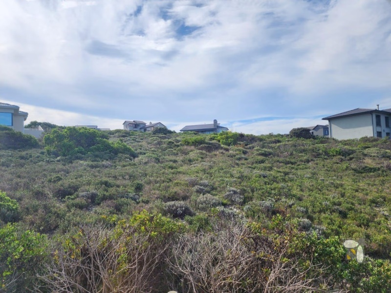 Vacant land Village on Sea Mossel Bay, 979m2 stand with ocean views, secure estate land for sale, coastal property for sale Western Cape, prestigious estate land.