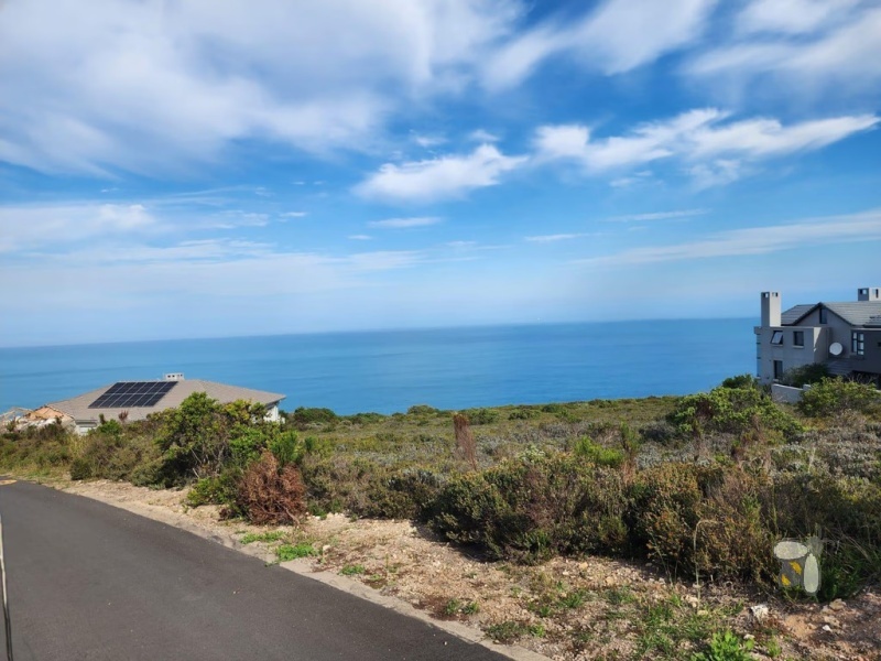 Vacant land Village on Sea Mossel Bay, 979m2 stand with ocean views, secure estate land for sale, coastal property for sale Western Cape, prestigious estate land.