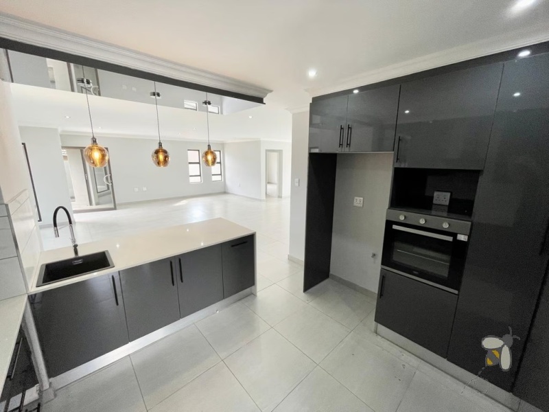 4 bedroom house to let Secunda estate, secure estate rental Secunda, modern family home for rent, rental with double garage and braai area, 24-hour access control property.