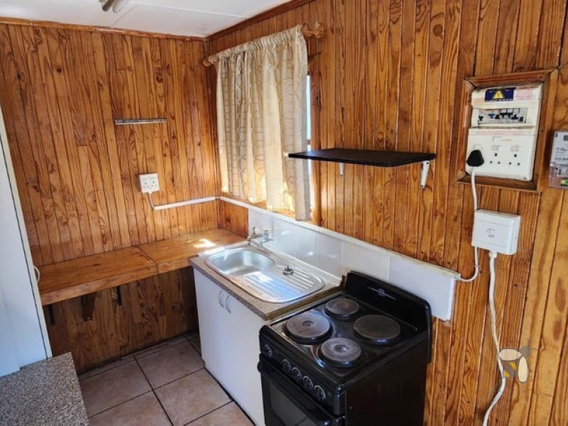 Kriel, property to rent, 1 bedroom, loghome, cozy living, open plan, water included, prepaid electricity, stoep, serene environment, unique rental.