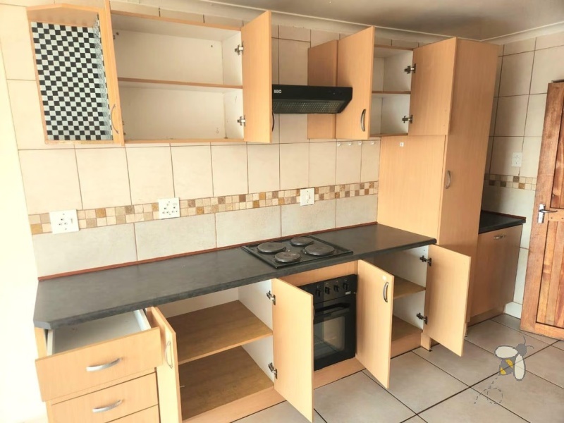 Secunda, 2 bedroom unit for sale, upmarket apartment, secure complex, modern kitchen, full bathroom, laminated flooring, garage, investment.