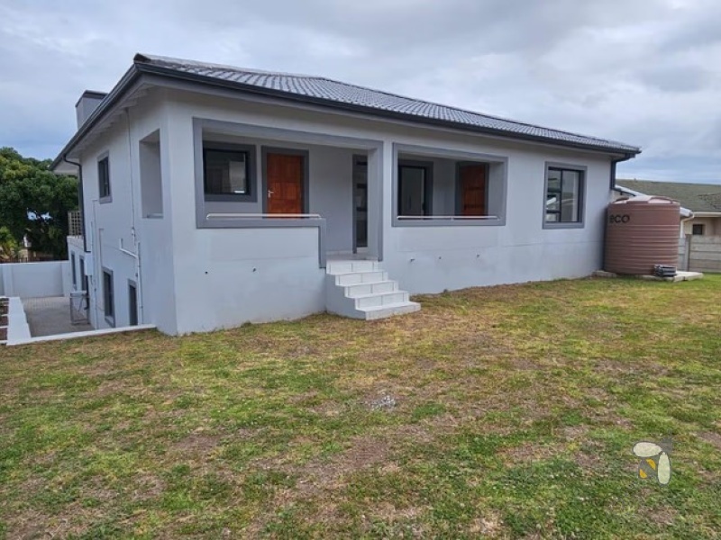 Wavecrest, 5 bedroom house for sale, double storey, sea views, open-plan living, built-in braai, gas stove, eco-friendly, water tank, modern luxury, PPRA registered.