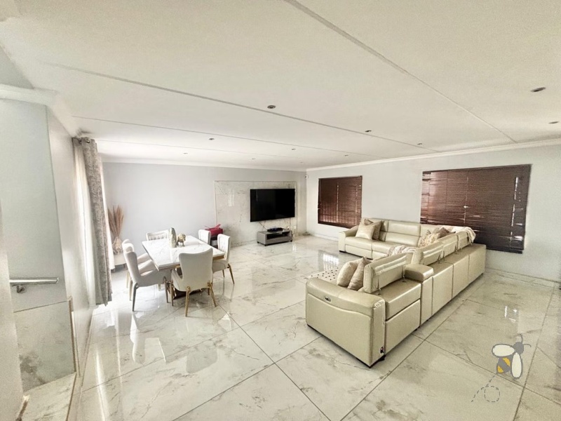 Noordrand, 4 bedroom house for sale, modern family home, swimming pool, built-in braai, open plan living, double garage, JoJo tank, upstairs lounge.