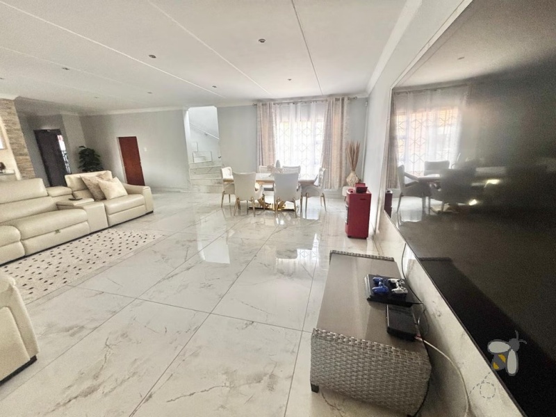 Noordrand, 4 bedroom house for sale, modern family home, swimming pool, built-in braai, open plan living, double garage, JoJo tank, upstairs lounge.