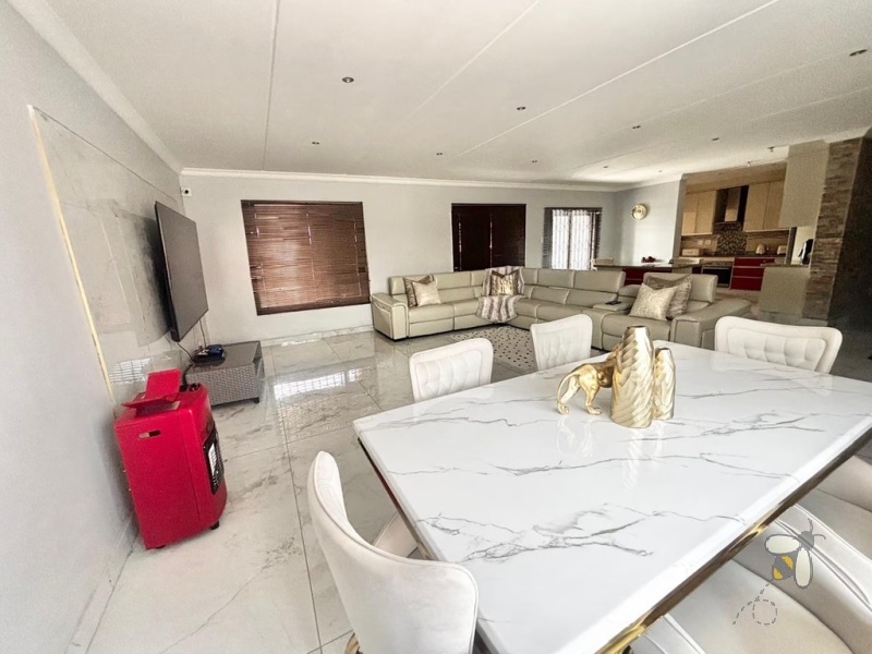 Noordrand, 4 bedroom house for sale, modern family home, swimming pool, built-in braai, open plan living, double garage, JoJo tank, upstairs lounge.