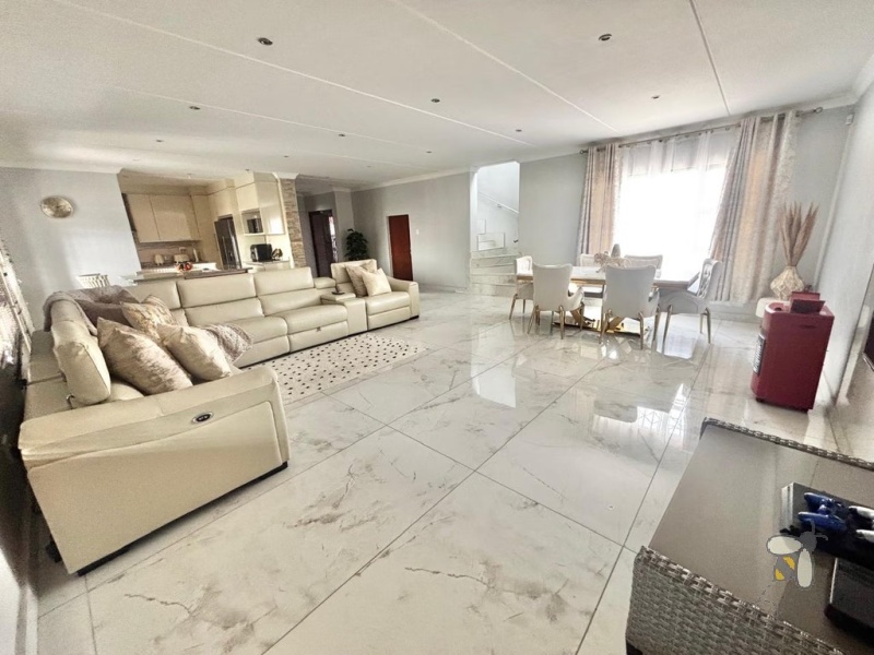 Noordrand, 4 bedroom house for sale, modern family home, swimming pool, built-in braai, open plan living, double garage, JoJo tank, upstairs lounge.