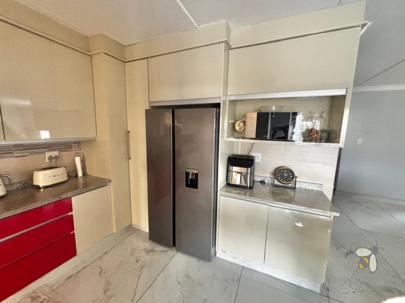 Noordrand, 4 bedroom house for sale, modern family home, swimming pool, built-in braai, open plan living, double garage, JoJo tank, upstairs lounge.