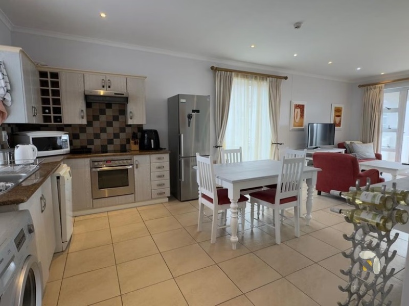 Pinnacle Point Estate, golf villa for sale, furnished, no levy payable, 2 bedroom, lock-up garage, golf cart included, resort living, Mossel Bay, investment opportunity, championship golf course, ground floor.