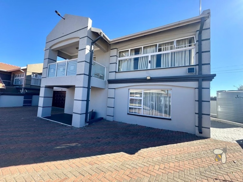 Secunda, double storey house for sale, central location, en-suite bathrooms, granite countertops, inverter system, JoJo water tank, power backup, modern kitchen, private balcony, spacious living.