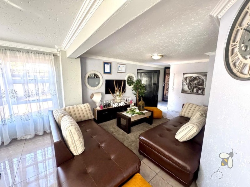 Secunda, double storey house for sale, central location, en-suite bathrooms, granite countertops, inverter system, JoJo water tank, power backup, modern kitchen, private balcony, spacious living.