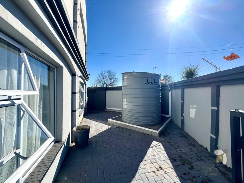 Secunda, double storey house for sale, central location, en-suite bathrooms, granite countertops, inverter system, JoJo water tank, power backup, modern kitchen, private balcony, spacious living.