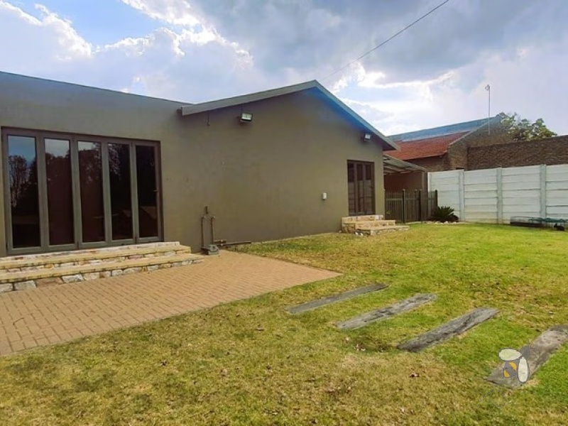 Standerton Central, 3 bedroom house for sale, move-in ready, secure home, electric gate, study area, reading room, built-in braai, private gym, spa bath, landscaped garden.