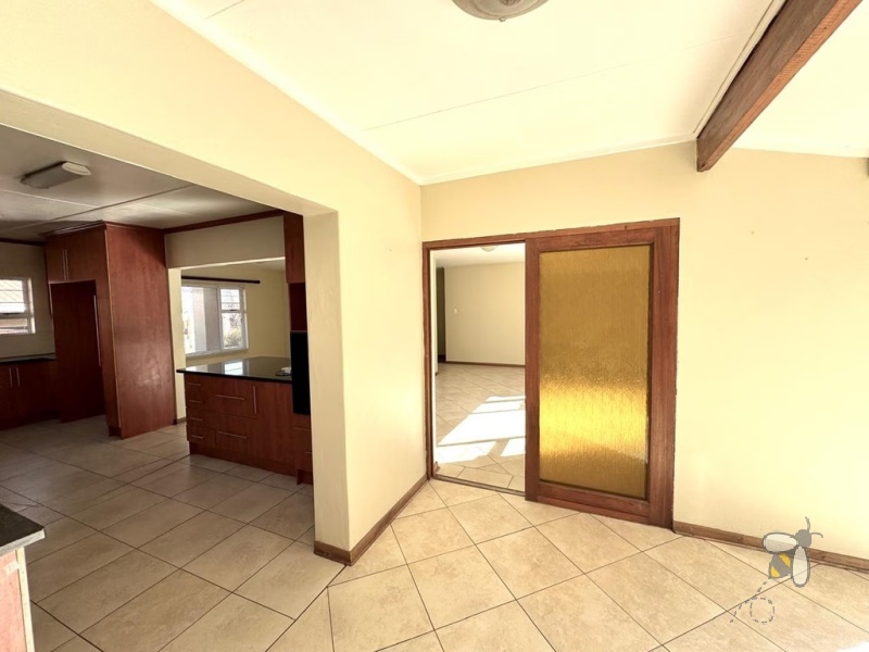 Secunda, 4 bedroom house for sale, spacious home, prime location, High School Secunda, swimming pool, built-in braai, granite countertops, parquet flooring, automated carport, low maintenance.