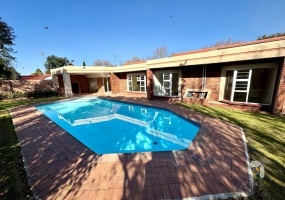 Secunda, 4 bedroom house for sale, spacious home, prime location, High School Secunda, swimming pool, built-in braai, granite countertops, parquet flooring, automated carport, low maintenance.