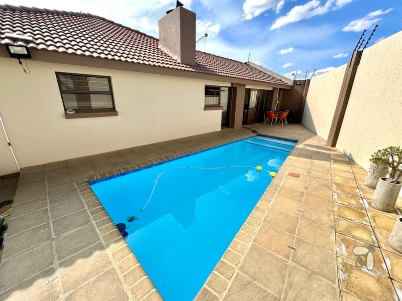 Secunda, 4 bedroom house for sale, modern comfort, walk-in wardrobe, gas hob, scullery, built-in braai, swimming pool, inverter system, JoJo tanks, multi-use room, smart investment.