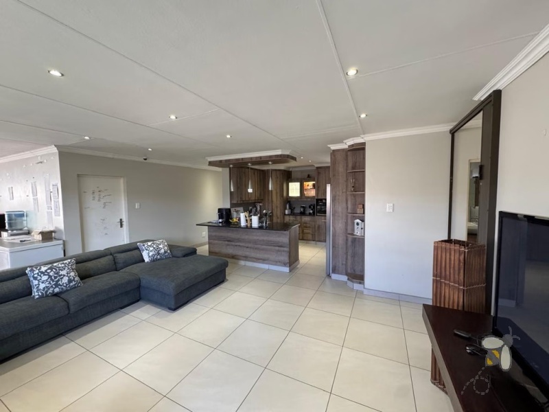 Secunda, 4 bedroom house for sale, modern comfort, walk-in wardrobe, gas hob, scullery, built-in braai, swimming pool, inverter system, JoJo tanks, multi-use room, smart investment.