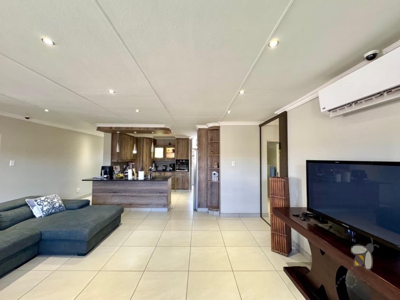 Secunda, 4 bedroom house for sale, modern comfort, walk-in wardrobe, gas hob, scullery, built-in braai, swimming pool, inverter system, JoJo tanks, multi-use room, smart investment.