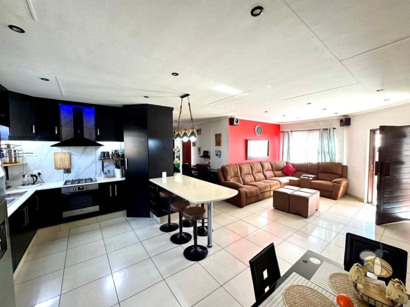 Secunda, 3 bedroom house for sale, modern family home, Caesarstone, gas hob, swimming pool, inverter system, JoJo tank, dual braai, double garage, open plan living, tiled throughout.