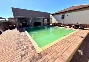 Secunda, 3 bedroom house for sale, modern family home, Caesarstone, gas hob, swimming pool, inverter system, JoJo tank, dual braai, double garage, open plan living, tiled throughout.