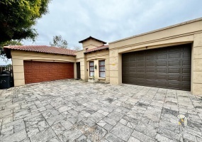 Secunda, Tuscan style home, 3 bedroom house for sale, renovated kitchen, indoor entertainment area, built-in braai, four garages, scullery, luxury living, serene neighborhood.