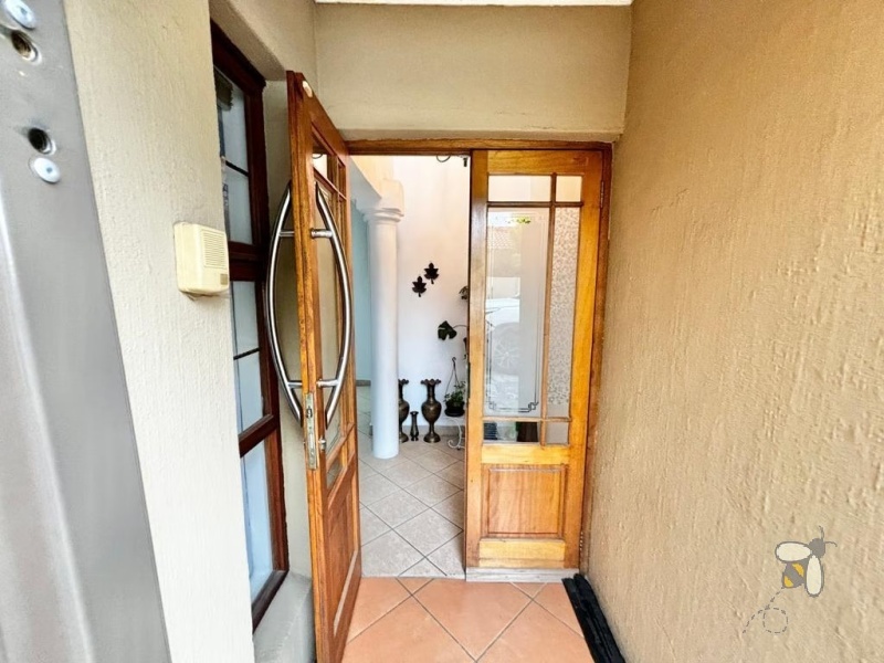 Secunda, Tuscan style home, 3 bedroom house for sale, renovated kitchen, indoor entertainment area, built-in braai, four garages, scullery, luxury living, serene neighborhood.