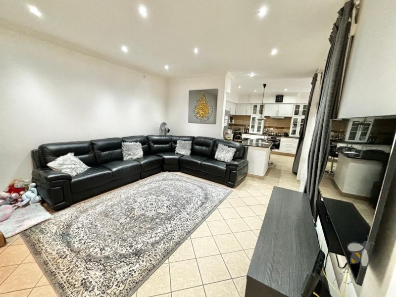 Secunda, Tuscan style home, 3 bedroom house for sale, renovated kitchen, indoor entertainment area, built-in braai, four garages, scullery, luxury living, serene neighborhood.