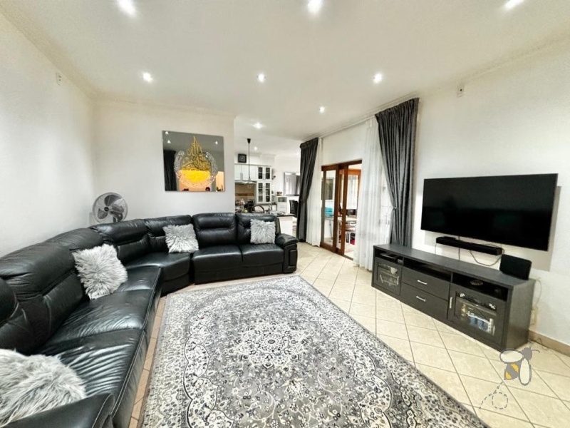 Secunda, Tuscan style home, 3 bedroom house for sale, renovated kitchen, indoor entertainment area, built-in braai, four garages, scullery, luxury living, serene neighborhood.