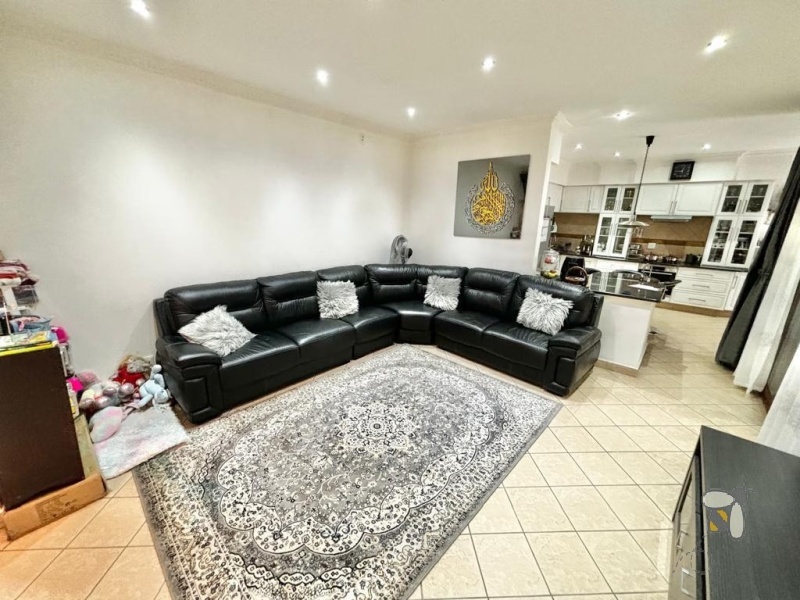 Secunda, Tuscan style home, 3 bedroom house for sale, renovated kitchen, indoor entertainment area, built-in braai, four garages, scullery, luxury living, serene neighborhood.