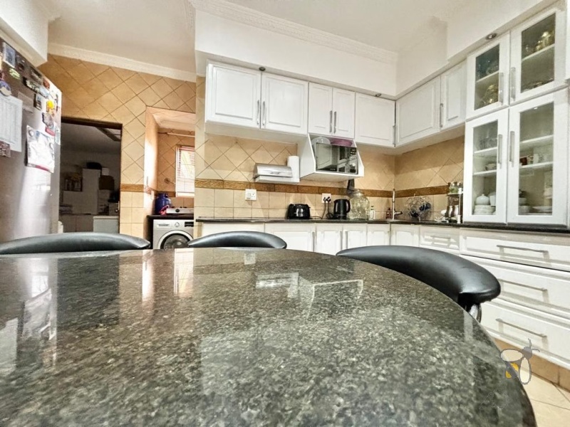 Secunda, Tuscan style home, 3 bedroom house for sale, renovated kitchen, indoor entertainment area, built-in braai, four garages, scullery, luxury living, serene neighborhood.