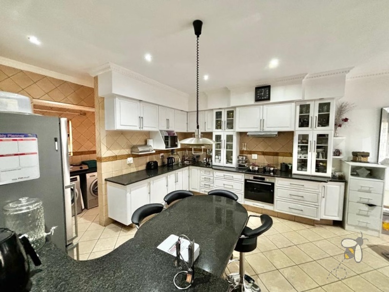 Secunda, Tuscan style home, 3 bedroom house for sale, renovated kitchen, indoor entertainment area, built-in braai, four garages, scullery, luxury living, serene neighborhood.