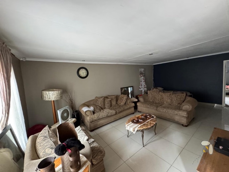 Secunda, 4 bedroom house for sale, central location, three living areas, swimming pool, lapa, built-in braai, single garage, double carport, family home, close to schools.