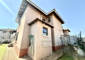 Secunda Central, double-storey home, 3 bedroom house for sale, indoor braai, granite countertops, gas stove, JoJo tank, high security, CCTV, wide staircase, modern living.