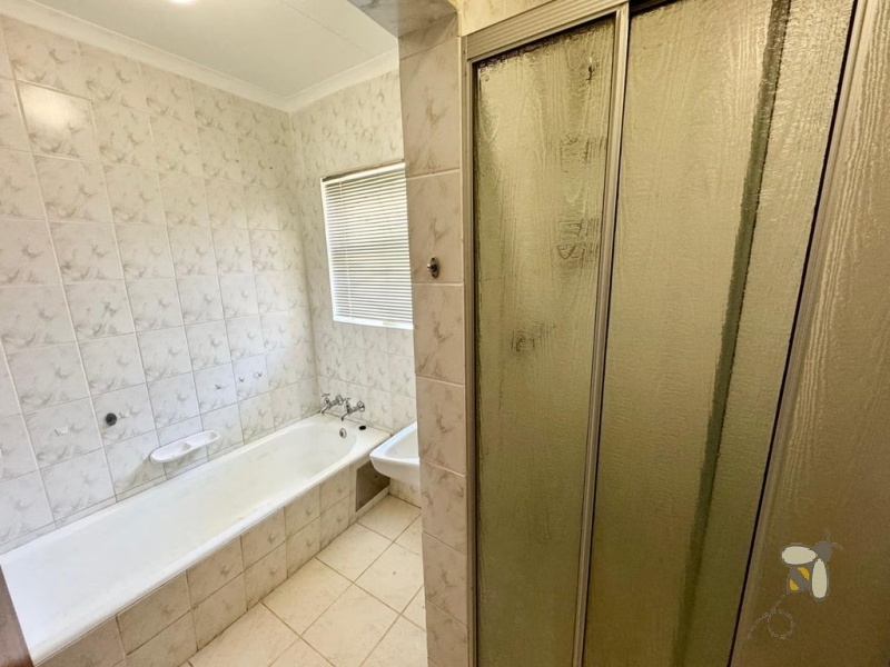 Secunda Central, 6 bedroom house for sale, two houses, dual living, investment property, rental income, corner stand, private yard, sunlit braai area, versatility.