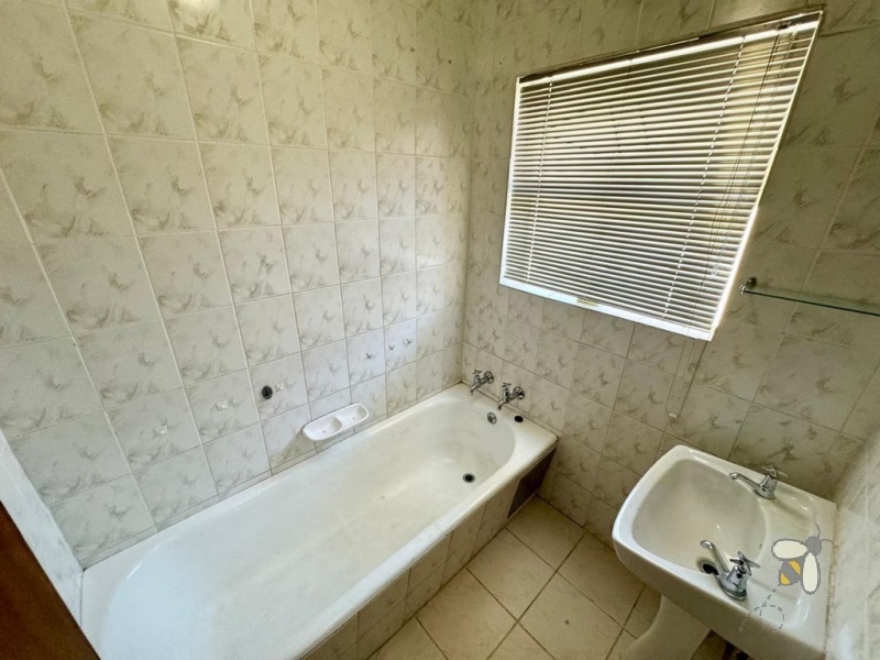 Secunda Central, 6 bedroom house for sale, two houses, dual living, investment property, rental income, corner stand, private yard, sunlit braai area, versatility.