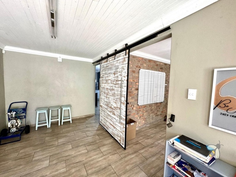 Secunda, versatile property, 4 bedroom house for sale, office space potential, opposite school, Caesarstone, borehole, inverter backup, built-in braai, granny flat potential, double garage.