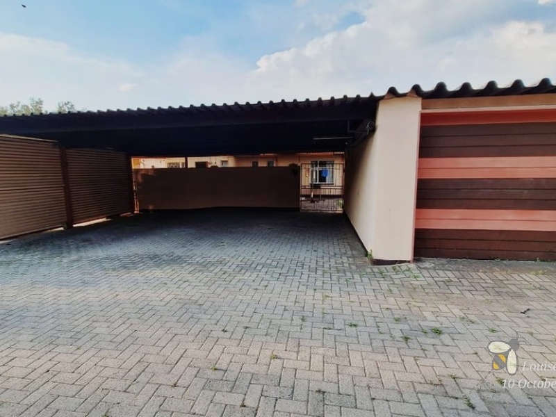 Secunda, 4 bedroom house for sale, secure area, solar panels, JoJo tank, built-in braai, large garden, modern kitchen, family home, sustainable living.