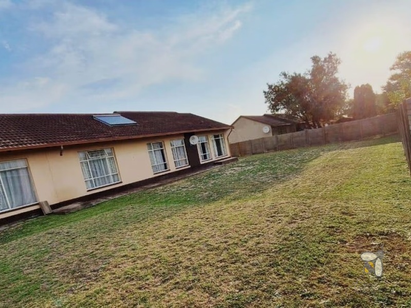 Secunda, 4 bedroom house for sale, secure area, solar panels, JoJo tank, built-in braai, large garden, modern kitchen, family home, sustainable living.
