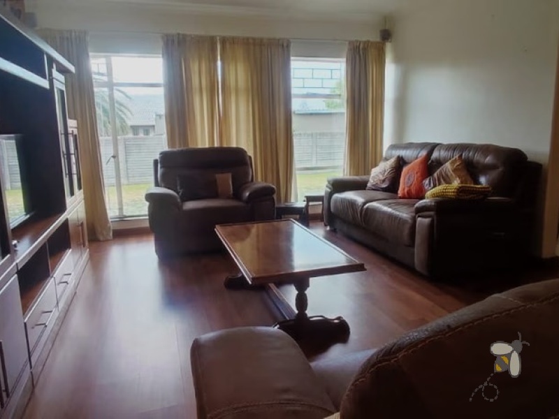 Secunda, 4 bedroom house for sale, secure area, solar panels, JoJo tank, built-in braai, large garden, modern kitchen, family home, sustainable living.