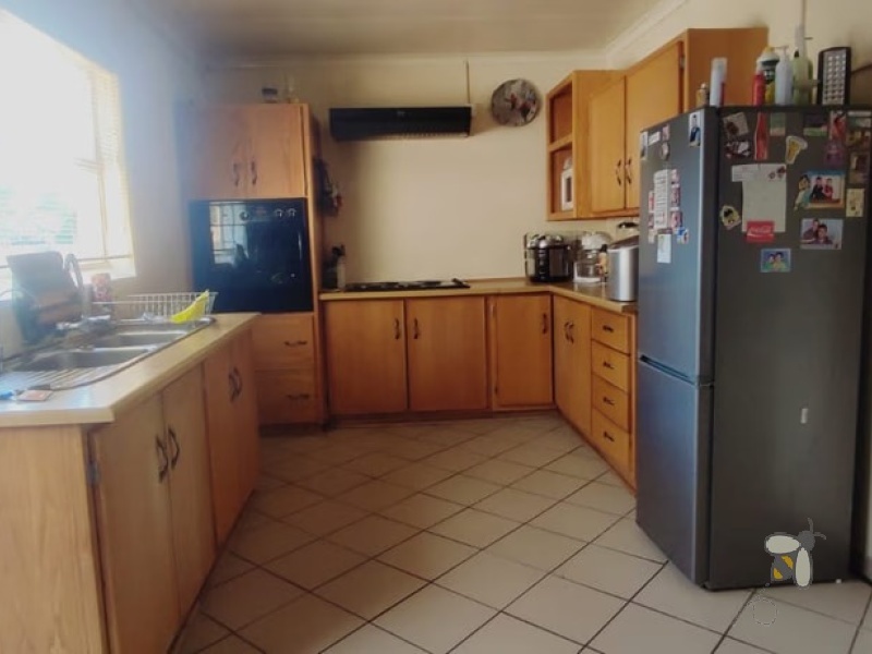 Secunda, 4 bedroom house for sale, secure area, solar panels, JoJo tank, built-in braai, large garden, modern kitchen, family home, sustainable living.