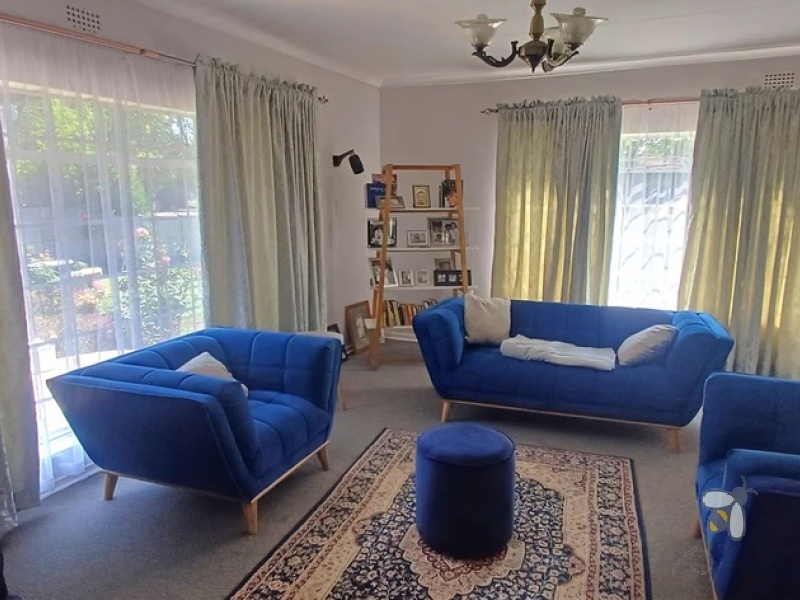 Kosmos Park, 4 bedroom house for sale, inviting home, open-plan living, custom en-suite, two lounges, outside room, income potential, two garages, spacious kitchen.