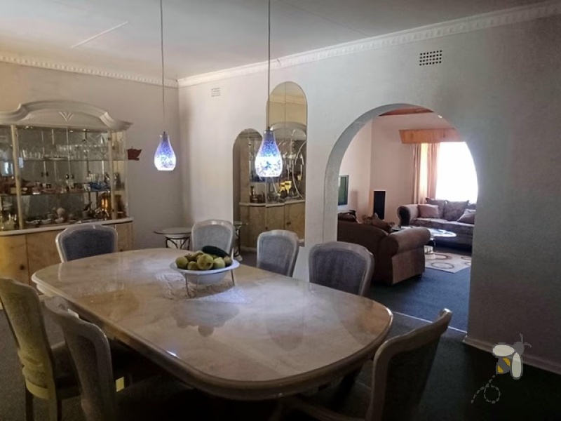 Kosmos Park, 4 bedroom house for sale, inviting home, open-plan living, custom en-suite, two lounges, outside room, income potential, two garages, spacious kitchen.