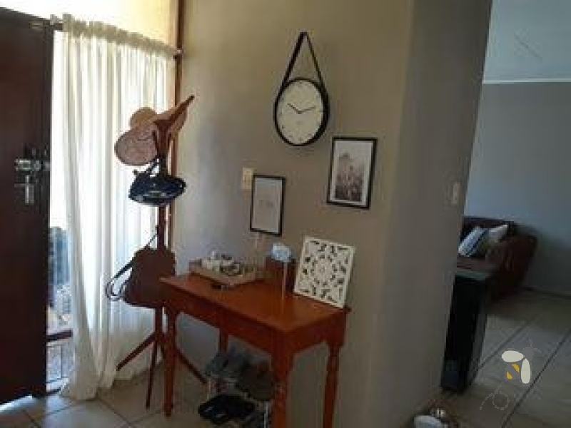 Secunda Central, investment property, 3 homes for sale, triplex, rental income, multi-generational living, 7 bedrooms total, private yards, carports, financial potential.