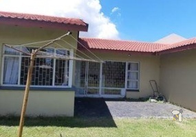 Secunda Central, investment property, 3 homes for sale, triplex, rental income, multi-generational living, 7 bedrooms total, private yards, carports, financial potential.